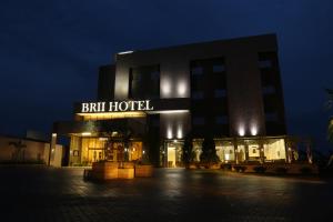 a building with a sign that reads bath hotel at night at Brii Hotel in Araguaína
