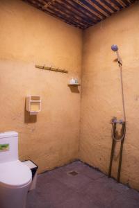 a bathroom with a toilet and a shower at Then Pa village in Loung Co +68 photos