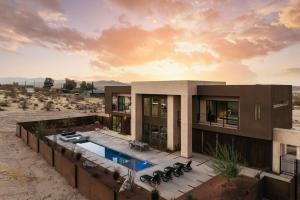 a house in the desert with a swimming pool at Suncrest by Fieldtrip - JT Modern w Pool and Views in Joshua Tree