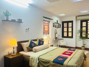 a bedroom with a large bed in a room at Kim's Home in Ba Dinh in Hanoi