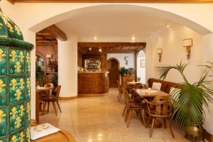 a dining room with a table and chairs at Hotel Pontechiesa in Cortina dʼAmpezzo