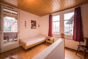 Ένα ή περισσότερα κρεβάτια σε δωμάτιο στο Chalet Cecile
