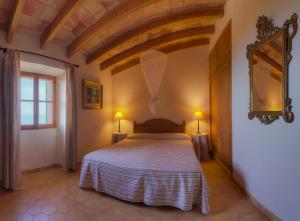 a bedroom with a large bed in a room at La Galera Deià in Deia