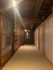 an empty hallway with a light on the ceiling at 陽月 Yo-Getsu in Yamaga