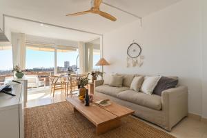 a living room with a couch and a table at Hawaii in Jávea