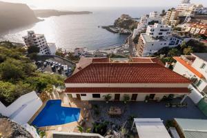 an aerial view of a building next to the ocean at I Boho Sun Oceanfront Apartment in Icod de los Vinos