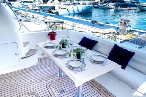 a table on the back of a boat in the water at Yacht Experience in Monaco Harbour in Monte Carlo