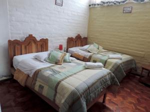 Postel nebo postele na pokoji v ubytování Hotel La Primavera + 24 fotografií