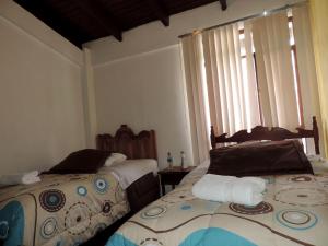 Кровать или кровати в номере Hotel La Primavera
