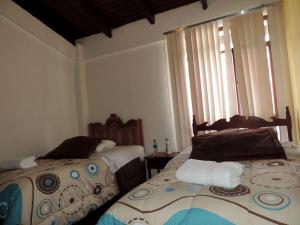 Postel nebo postele na pokoji v ubytování Hotel La Primavera