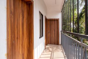 a wooden door on the side of a house at SAAD Residency in Cochin
