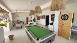 a living room with a pool table in it at Nyumba Simba House - Luxury Villa in Watamu