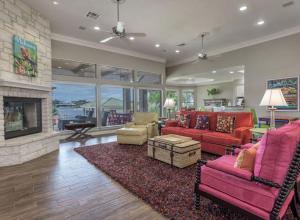 a living room with red furniture and a fireplace at Horseshoe Bay Resort in Horseshoe Bay