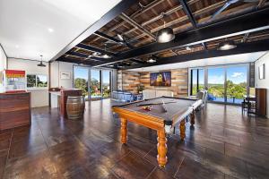 a large room with a pool table in it at Kin Kin Farm House - Pets Allowed in Kin Kin