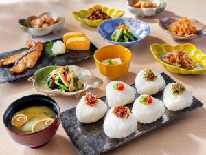 a table with plates of food and bowls of soup at Osaka View Hotel Honmachi in Osaka +109 photos