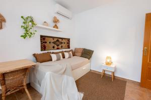a living room with a couch and a table at Comeback Villa Itaca in Motril +41 photos