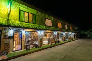 a store front of a building at night at HOST'S EL Fisherman in Nathon Bay