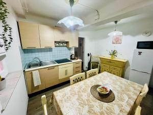 a kitchen with a table with a bowl of food on it at Dolce casa in Lucca