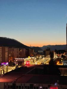 a view of a city at night at Apartament Piatra Neamț Centru in Piatra Neamţ