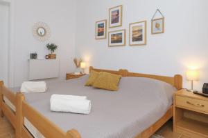 a bedroom with a bed with two pillows on it at Hibis, No 2 in Starigrad