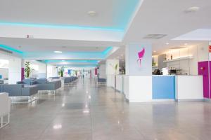 a lobby with a cafeteria with tables and chairs at BLUESEA Marieta & Spa in Playa del Ingles +33 photos