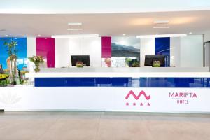 a lobby of a marica hotel with a reception counter at BLUESEA Marieta & Spa in Playa del Ingles