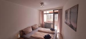 a small room with a couch and a window at Ferienresort mit Pool am Schluchsee in Schluchsee +58 photos
