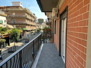 a balcony of a building next to a building at Ferrera Suite & Rooms in Misterbianco
