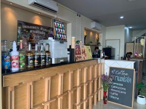 a bar in a restaurant with a counter at Uncle Yo House in Phuket