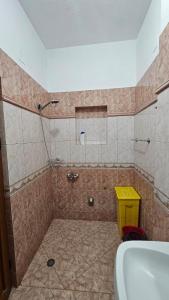 a bathroom with a shower with a tub and a sink at Honey-House Kastrioti Adventures in Përmet +99 photos