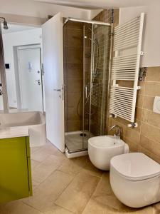 a bathroom with a shower and a toilet and a sink at VastoMare - appartamento Vasto Marina in Vasto +44 photos