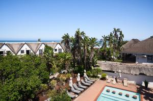 an aerial view of a resort with a swimming pool at Crawfords Beach Lodge in Chintsa