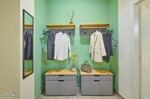 a dressing room with a mirror and clothes hanging on a wall at Daniel House - Lake and ferry terminal 1 minute walk, in the heart of Bellano in Bellano +40 photos