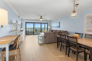 a living room with a couch and a table and chairs at Sunset Captiva Bayside Unit 103 condo in Captiva +25 photos