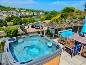 a jacuzzi tub on the roof of a house at High Cross House in Millbrook