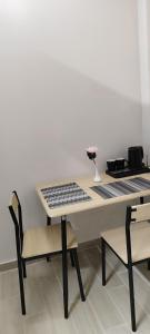 a table with a keyboard and a vase on it at A&Bpikermistudios2 in Pikérmion