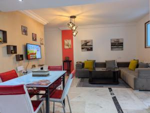 a living room with a couch and a table at Tanger City 2 in Tangier