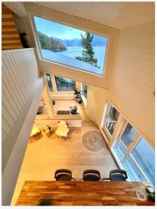 an overhead view of a dining room with a large window at Torvika Hus in Isfjorden