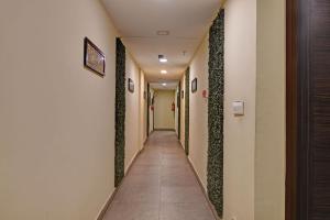 a corridor of a hospital hallway at FabHotel The Crown Aura in kolkata