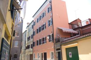 a group of buildings in a narrow street at Iris Chioggia in Chioggia +3 photos