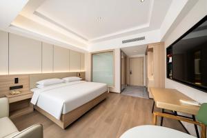 Lova arba lovos apgyvendinimo įstaigoje 上海悦来度假酒店Shanghai Joy International Resort Hotel