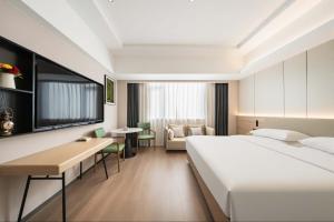 Lova arba lovos apgyvendinimo įstaigoje 上海悦来度假酒店Shanghai Joy International Resort Hotel