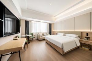 Lova arba lovos apgyvendinimo įstaigoje 上海悦来度假酒店Shanghai Joy International Resort Hotel