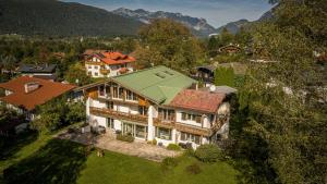 an aerial view of a house with a green roof at Villa Marga Ferienwohnung Jenner in Schönau am Königssee