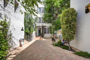 a cobblestone street in front of a white building at Alex Hotel & Spa in Marseille