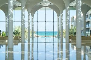 a view of the ocean from the lobby of a building at Kempinski Hotel Muscat in Muscat +246 photos