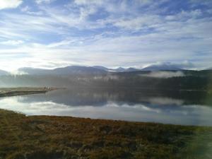a view of a body of water with mountains in the background at Kiwi Cove Lodge in Ladysmith