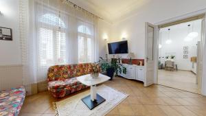a living room with a couch and a table at Pribina Penzión in Nitra