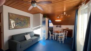 a living room with a couch and a table at Mar Dolomiti Suite by Ca-Sa Check in San Michele