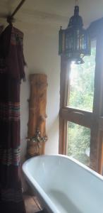 a bathroom with a bath tub and a window at tausend plus eine nacht in Vöhl